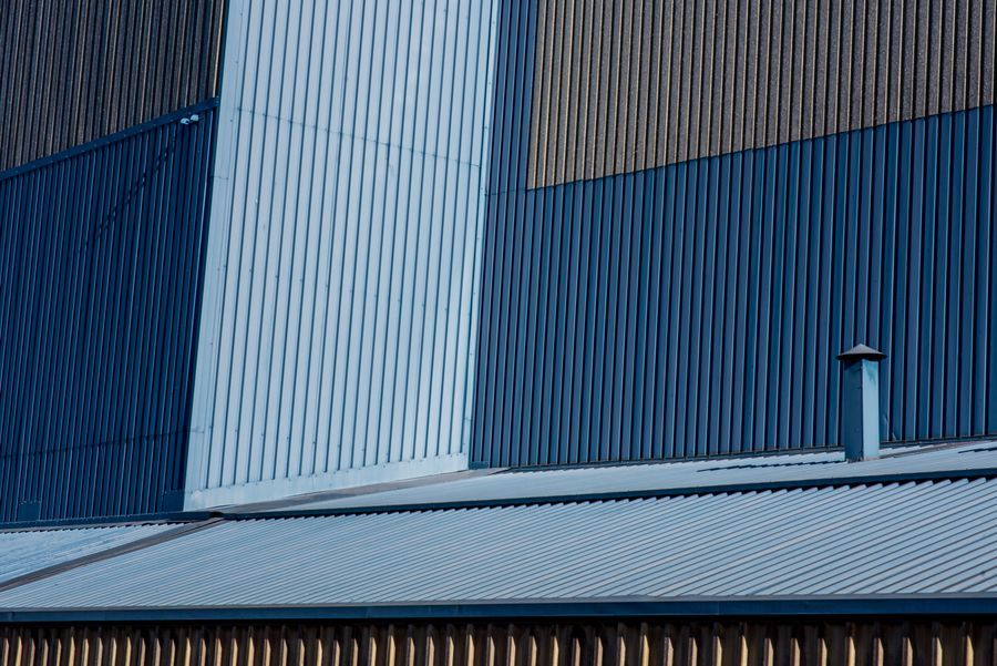 Close-up of the corrugated metal cladding of an industrial building