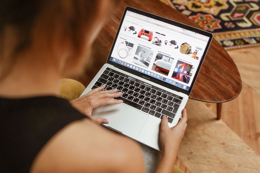 Someone browsing an online marketplace on a laptop