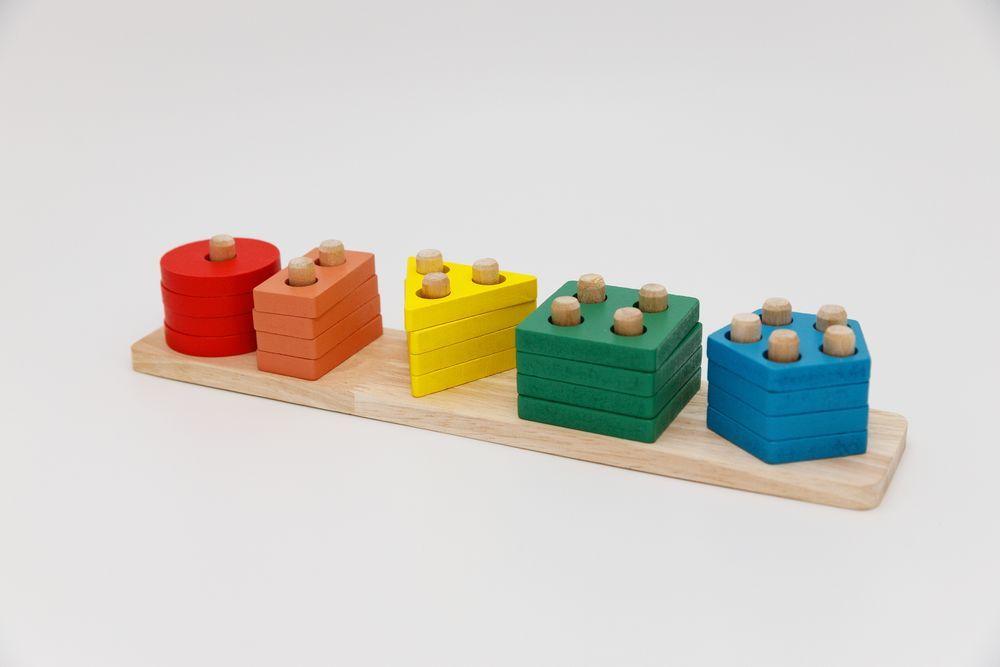 Colourful wooden stacking toy on a stand