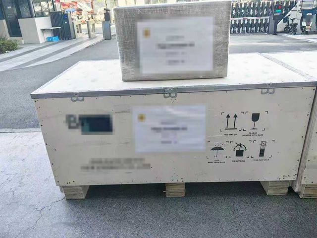 Export crates with handling marks, prepared for shipment from China