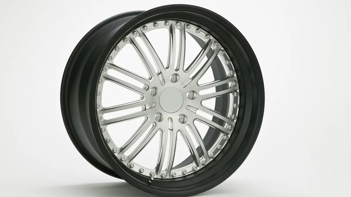 A car wheel rim and tire.