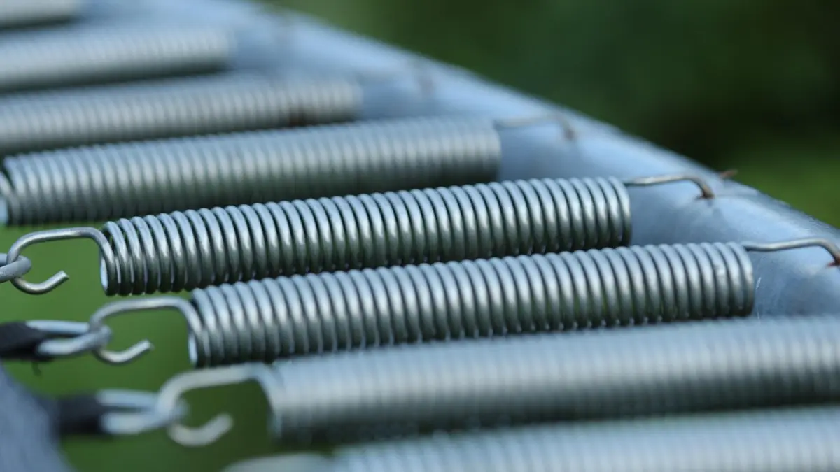 A close-up of a trampoline spring.