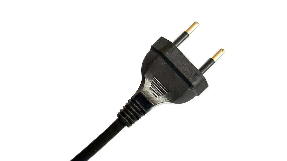 An electrical plug, outlet and wire.