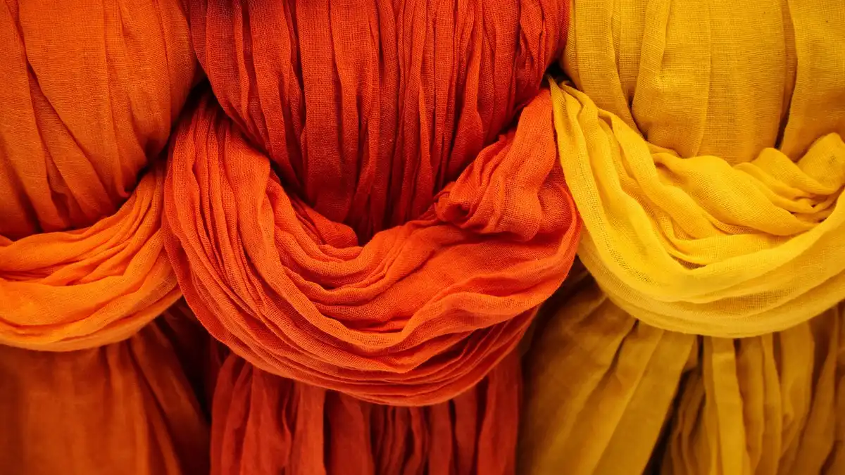 Vibrant woven fabric with creases.