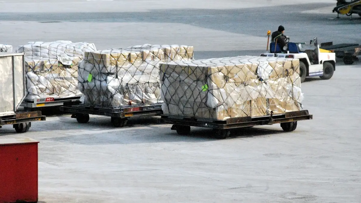 Cardboard boxes and cargo on a pallet in a warehouse.