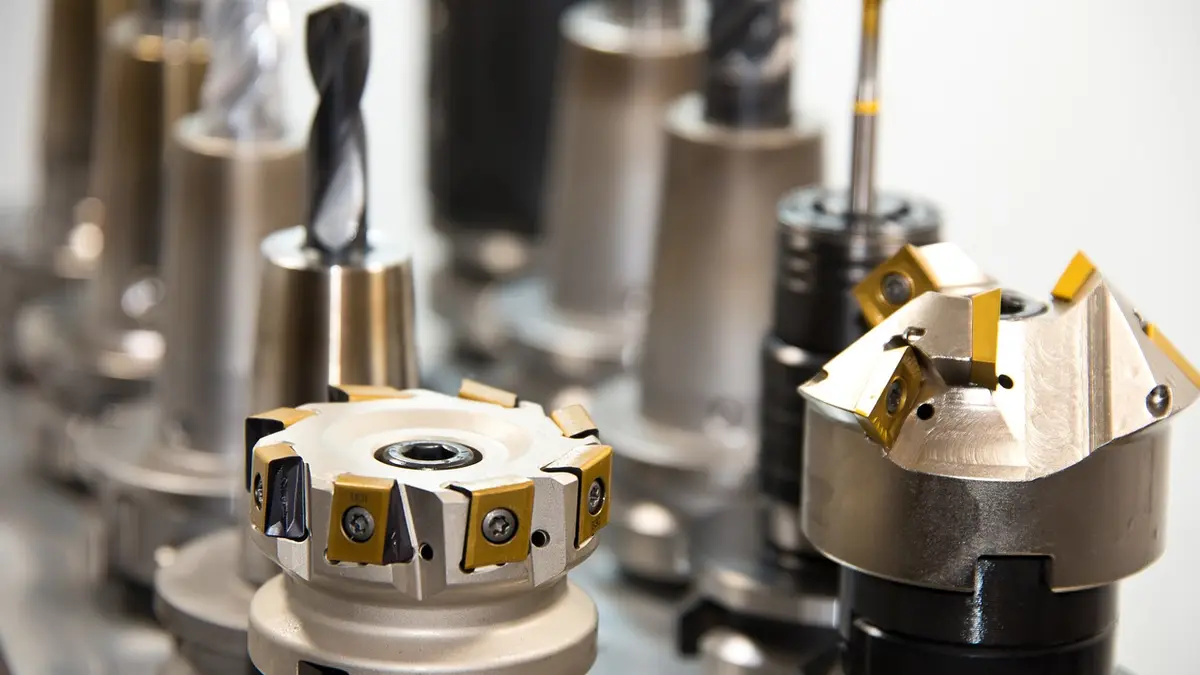 Cutting tools and a drilling head on a CNC machine.