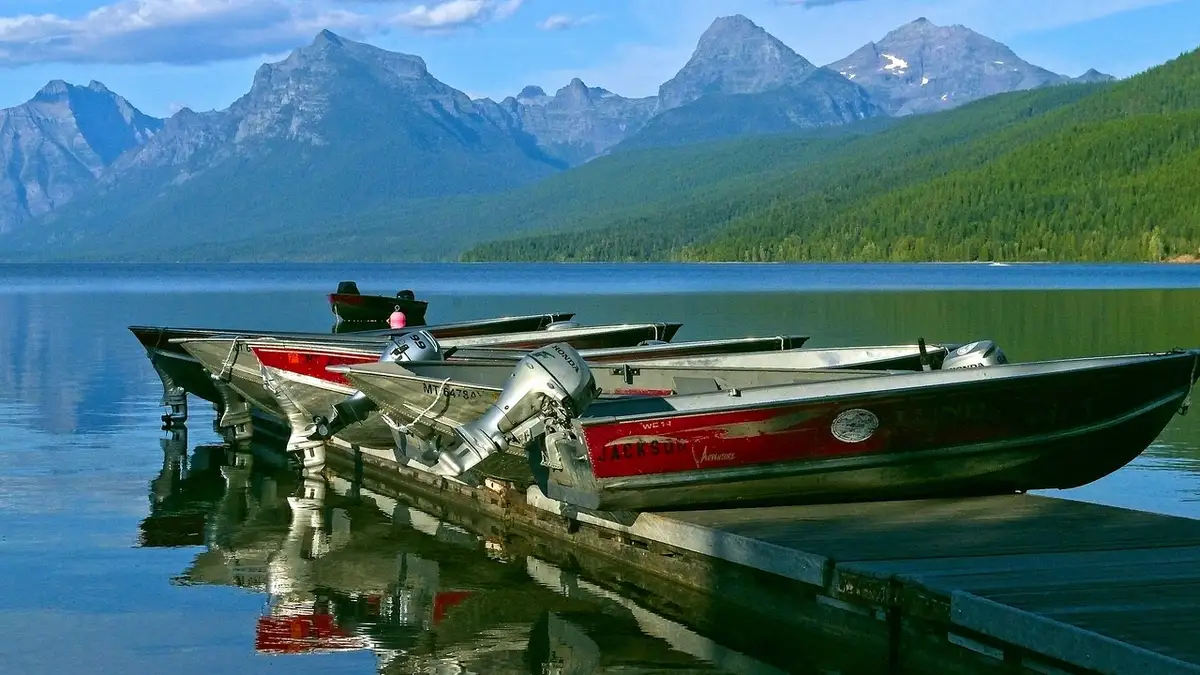 Motorboats at a dock on a lake.