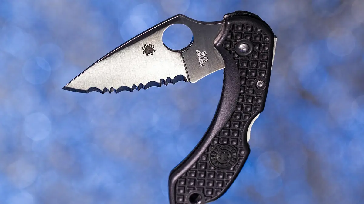 A folding pocket knife with a serrated blade.