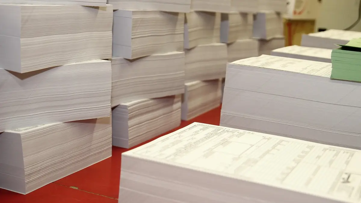 Paper cutting and processing in a printing house.