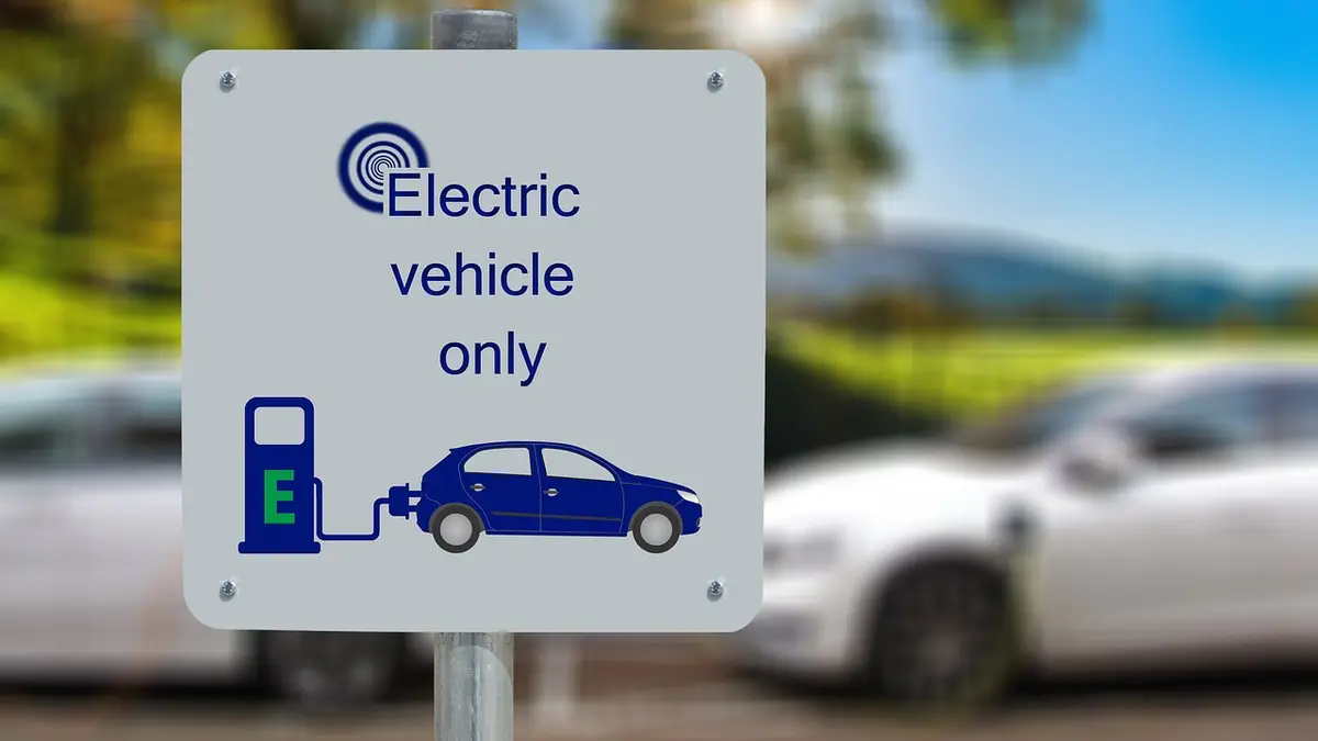Electric car connected to a charging point by its charging cable
