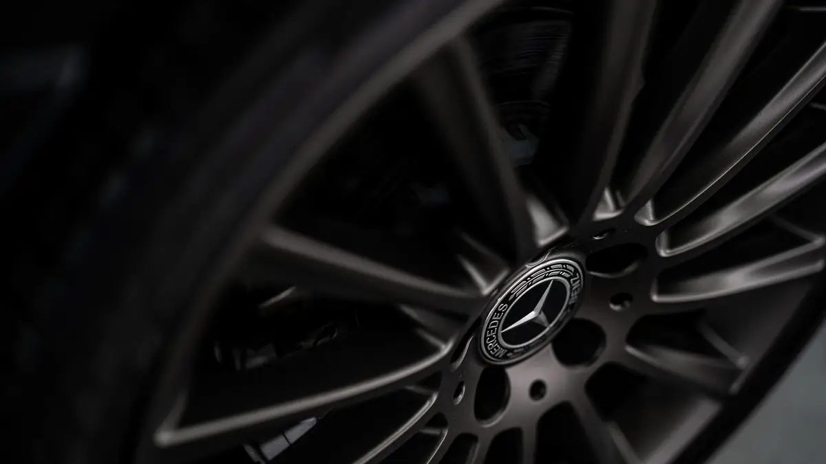 Close-up of a black alloy wheel and tyre on a car