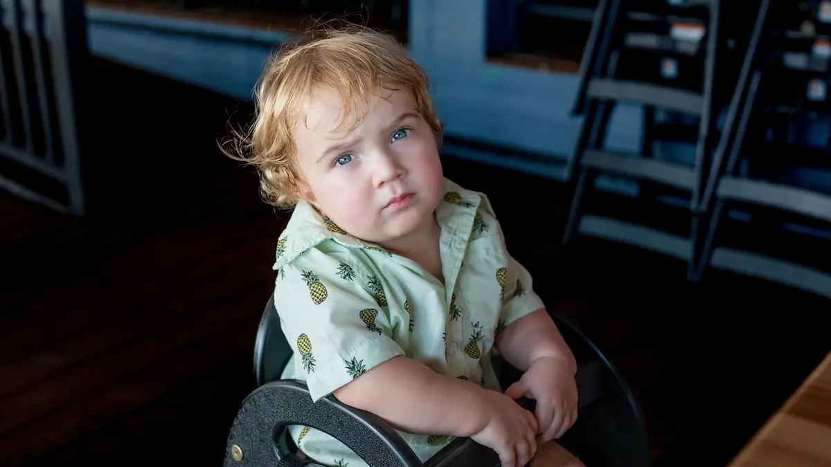 A baby in a high chair.