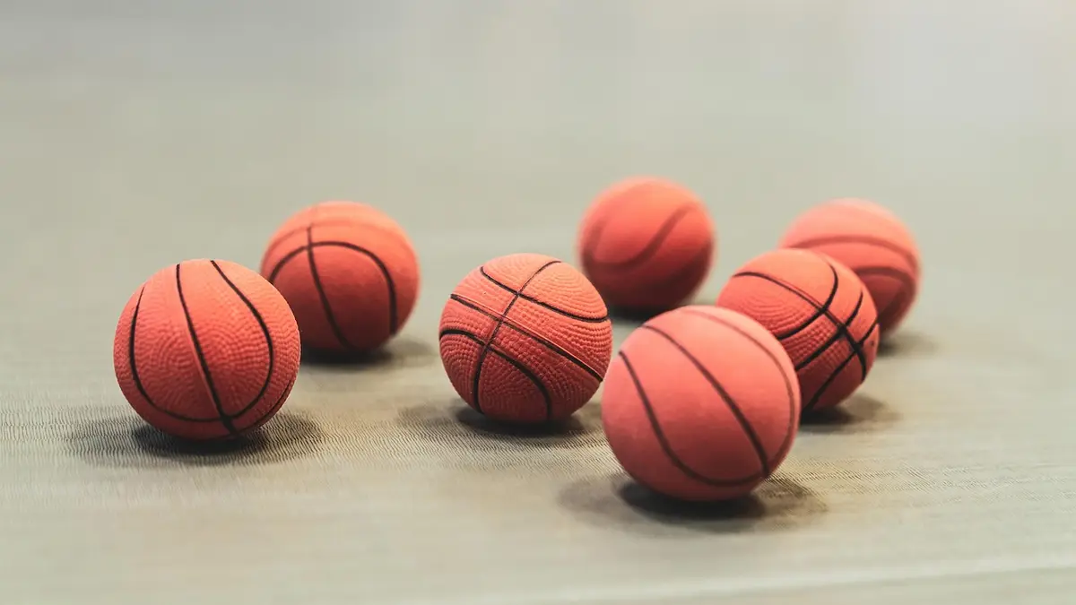 A basketball on an indoor court.