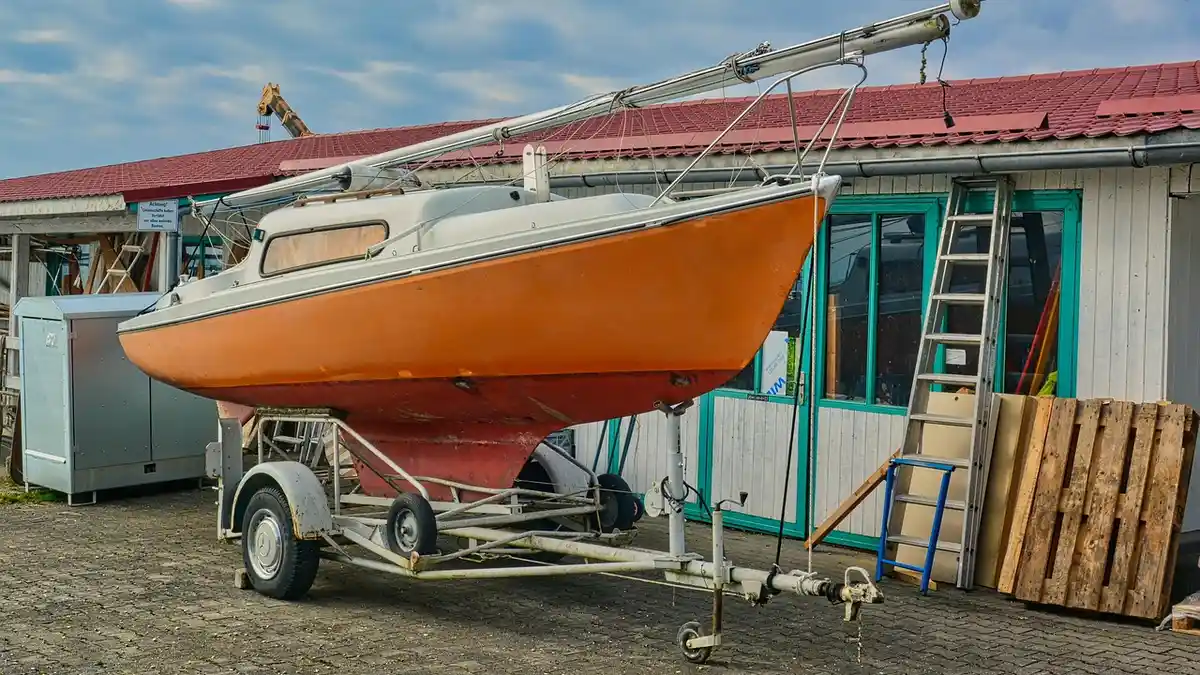 A boat trailer at a maintenance workshop.