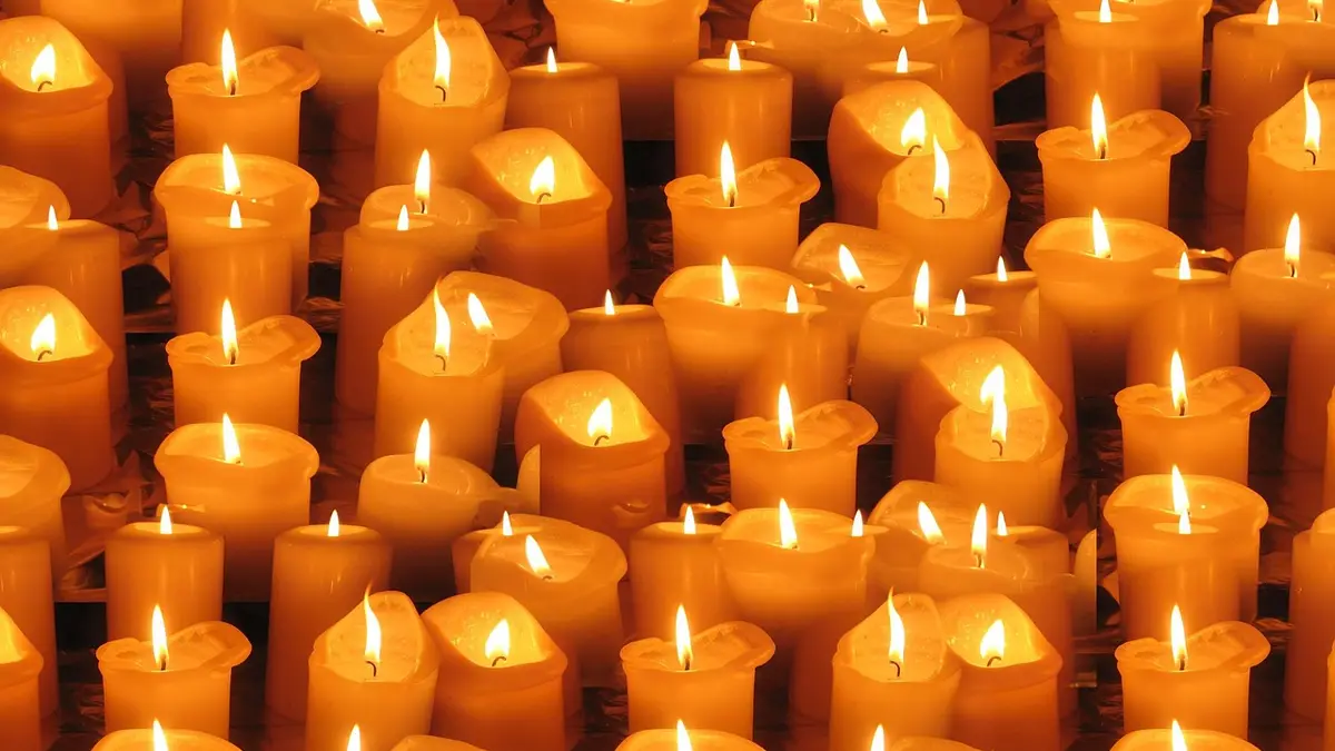 A close-up of lit church candles.