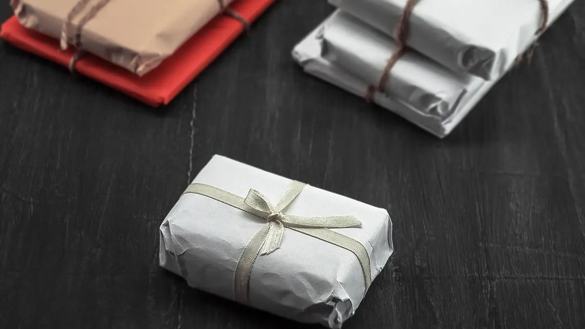 Parcel wrapped in brown kraft paper and tied with string