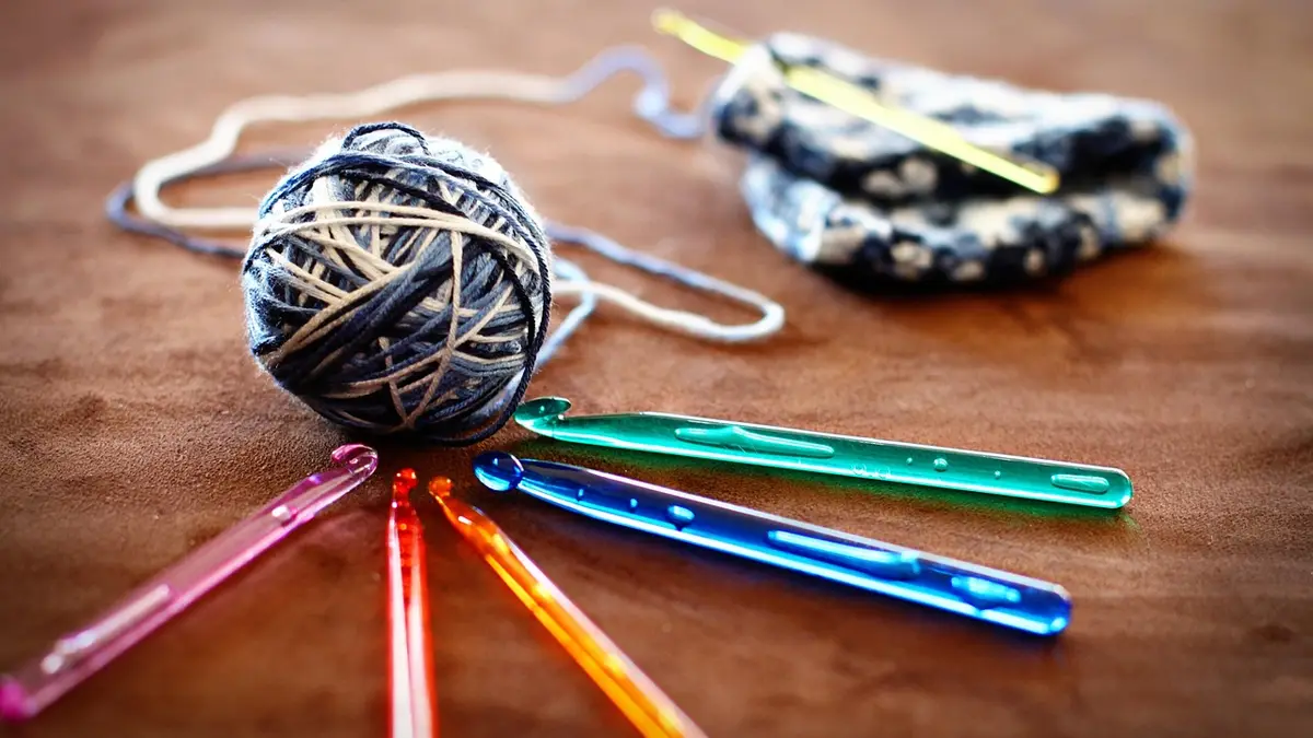 Crochet hooks with multicoloured yarn.