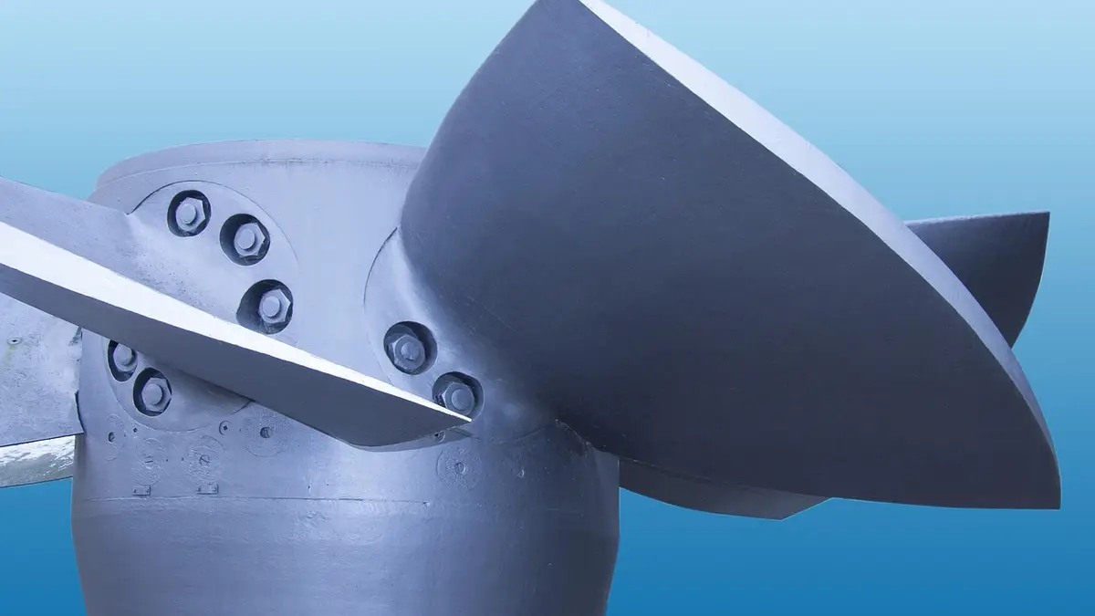 A water turbine with propeller blades for hydroelectric power.