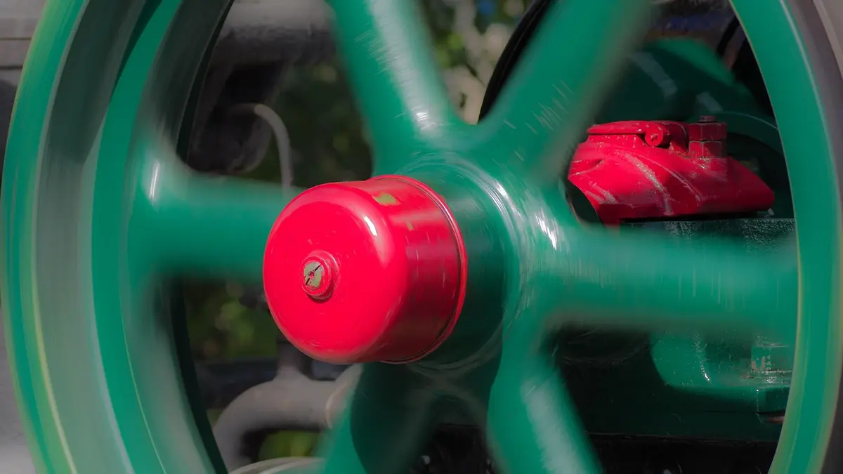 A flywheel on an old threshing machine.