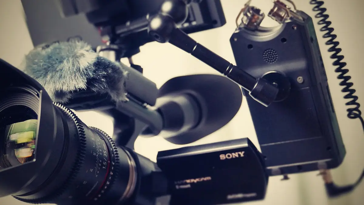 A Sony VG30 camcorder with a lens and audio recording equipment.