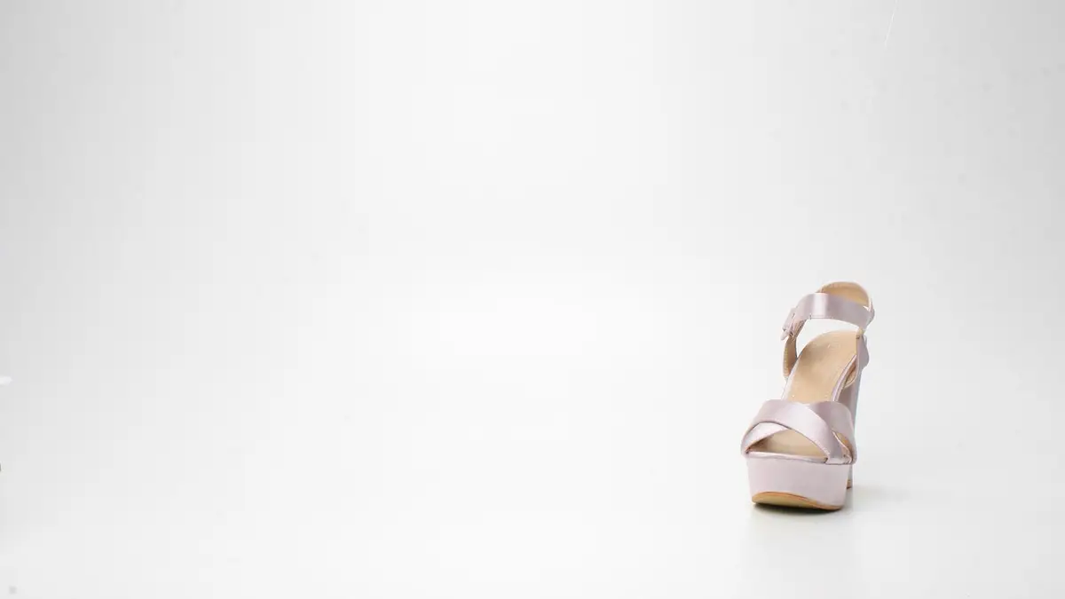 A women's satin high-heeled shoe.
