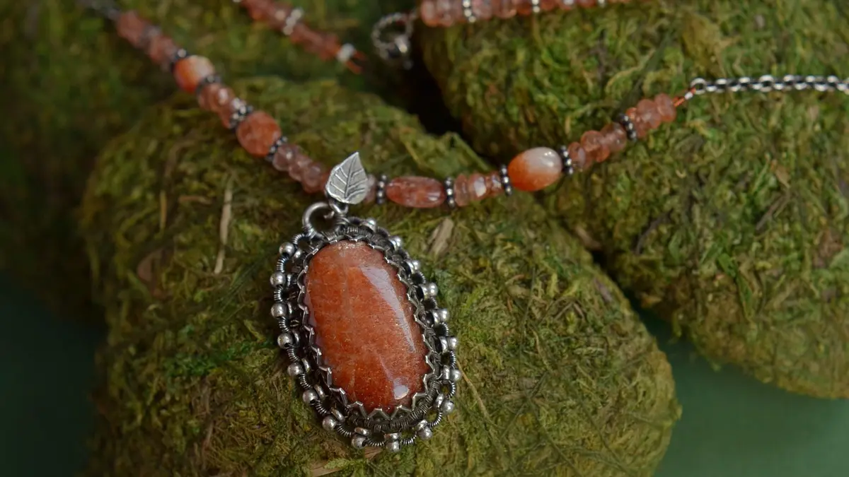 Silver wire jewellery with a gemstone.