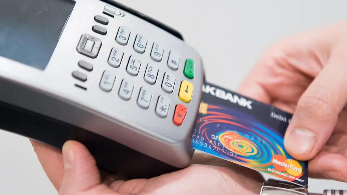 An electronic credit and debit card machine.