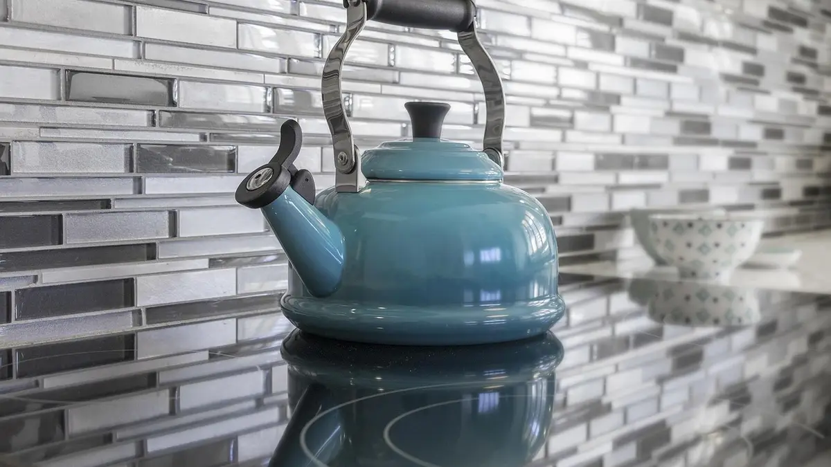 A kettle on a kitchen stove.