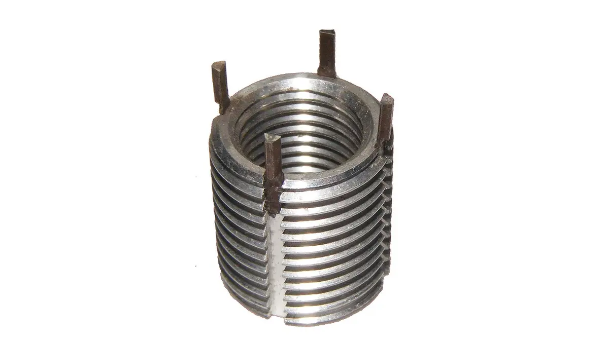 A spark plug and a thread insert for thread repair.
