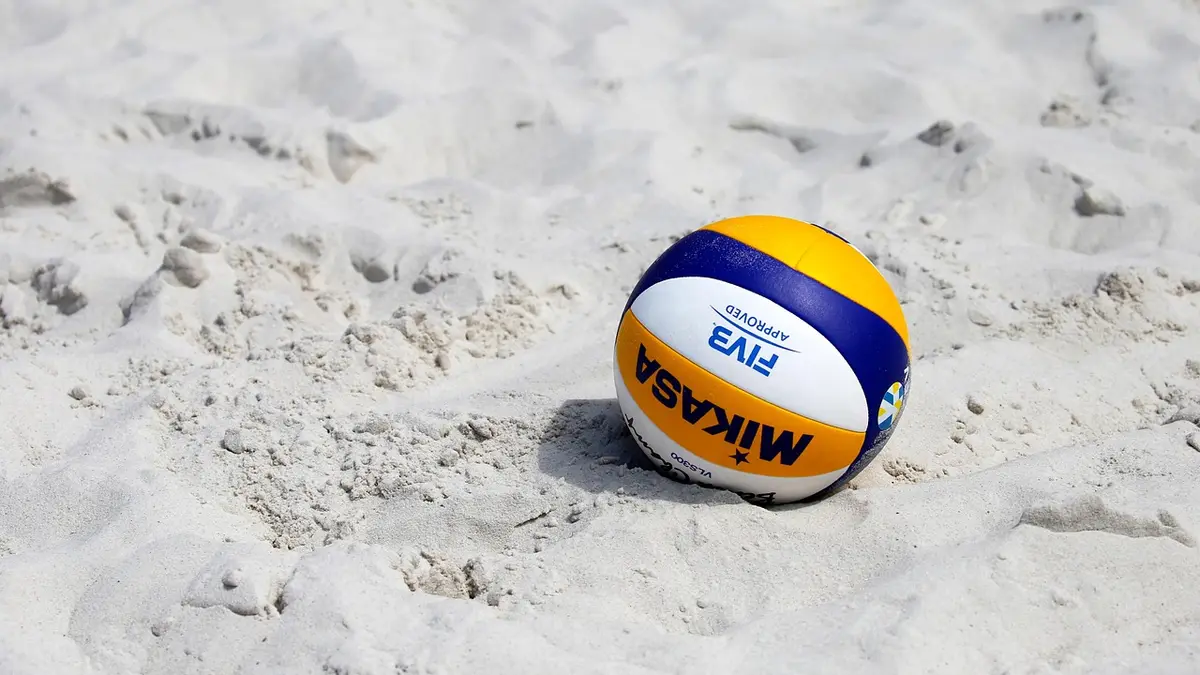 A volleyball on sand.
