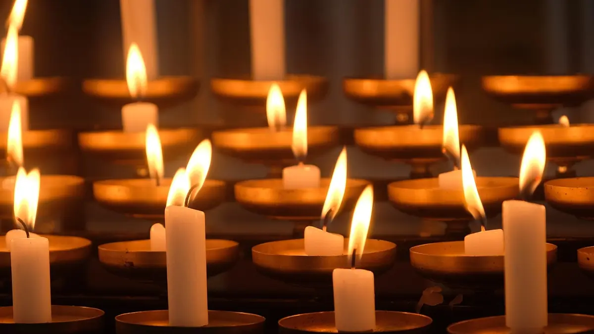 Burning votive candles.