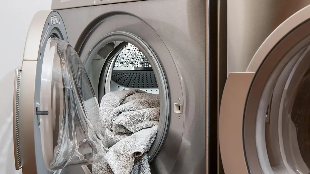 A washing machine and tumble dryer for laundry.